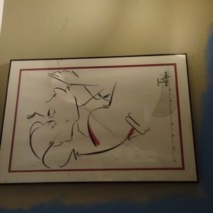 Ty Wilson glass framed and matted print. This one is broke but the print is good